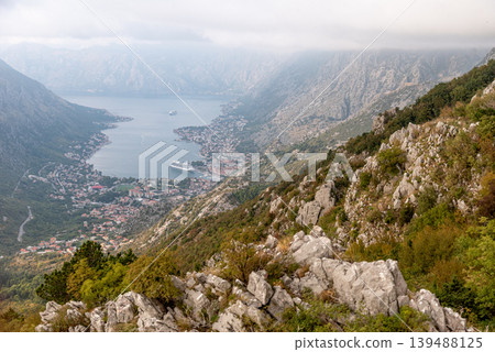 View from cable car to Boka Kotor Bay, large tourist liner parked among mountain View from cable car to Boka Kotor Bay, large tourist liner parked among mountain 139488125