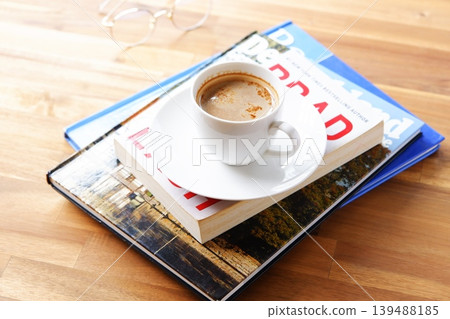 Coffee and books - An image of leisurely enjoying a book while sipping freshly brewed coffee. 139488185