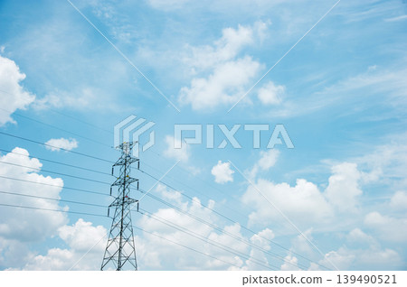 a big electric post with cloudy sky a big electric post with cloudy sky 139490521