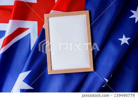 White empty paper copy space template mock up Australian flag background. National symbol and patriotism concept, ideal mock-up for custom copy designs. Place your logo or text on the white paper White empty paper copy space template mock up Australian flag background. National symbol and patriotism concept, ideal mock-up for custom copy designs. Place your logo or text on the white paper 139490779