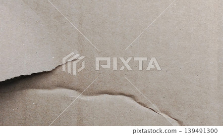 Close up of torn brown recycled paper texture background Close up of torn brown recycled paper texture background 139491300