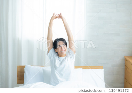A man sleeping in bed A man sleeping in bed 139491372