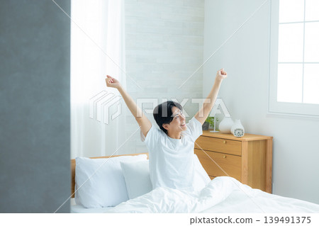 A man sleeping in bed A man sleeping in bed 139491375