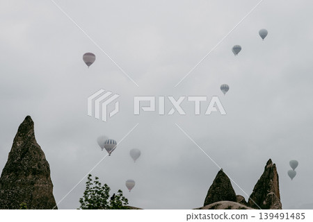 Air balloon flight early morning dawn cloudy sky mountain rock Cappadocia Turkey Air balloon flight early morning dawn cloudy sky mountain rock Cappadocia Turkey 139491485