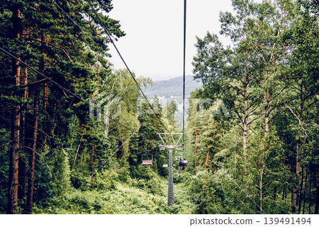 Ski resort view of ski track with cable car summer, Belokurikha Siberia Russia Ski resort view of ski track with cable car summer, Belokurikha Siberia Russia 139491494