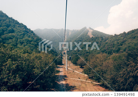 Ski resort view of ski track with cable car summer, Tufandag, Tfan, Azerbaijan Ski resort view of ski track with cable car summer, Tufandag, Tfan, Azerbaijan 139491498