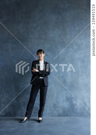 A businesswoman wearing a pantsuit A businesswoman wearing a pantsuit 139491519
