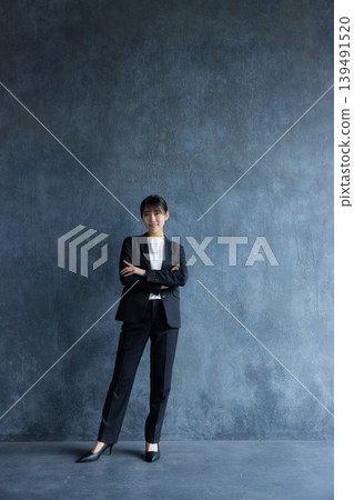 A businesswoman wearing a pantsuit A businesswoman wearing a pantsuit 139491520