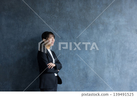 A businesswoman wearing a pantsuit A businesswoman wearing a pantsuit 139491525