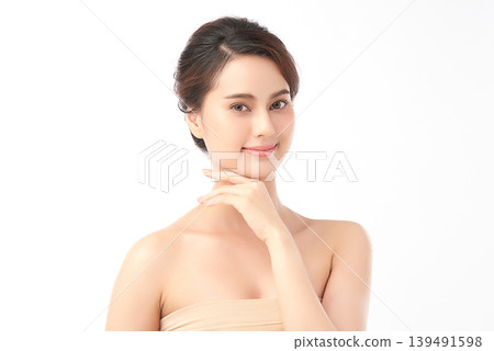 A beautiful young Asian woman with clean, fresh skin against a white background. Skincare, facial treatment, cosmetology, beauty, and spa. An elegant portrait of an Asian woman. A beautiful young Asian woman with clean, fresh skin against a white background. Skincare, facial treatment, cosmetology, beauty, and spa. An elegant portrait of an Asian woman. 139491598