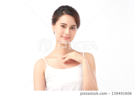 A beautiful young Asian woman with clean, fresh skin against a white background. Skincare, facial treatment, cosmetology, beauty, and spa. An elegant portrait of an Asian woman. A beautiful young Asian woman with clean, fresh skin against a white background. Skincare, facial treatment, cosmetology, beauty, and spa. An elegant portrait of an Asian woman. 139491606