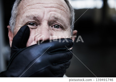 Man, kidnap and hand cover mouth in portrait with fear, scared and horror for crime, ransom and abduction. Sad face of senior person with gangster or scary criminal for robbery, scam and hostage Man, kidnap and hand cover mouth in portrait with fear, scared and horror for crime, ransom and abduction. Sad face of senior person with gangster or scary criminal for robbery, scam and hostage 139491746