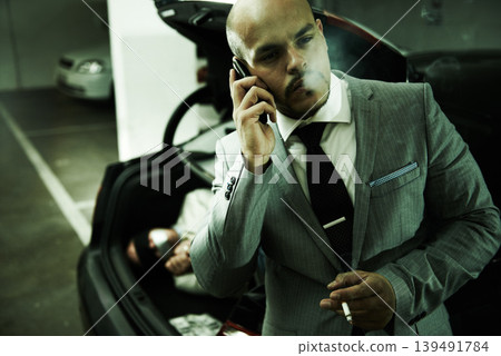 Mafia, car and man with hostage in trunk for negotiation, kidnapping ransom or crime. Phone call, gangster criminal and business person smoking in boot for abduction, danger or robbery in parking lot Mafia, car and man with hostage in trunk for negotiation, kidnapping ransom or crime. Phone call, gangster criminal and business person smoking in boot for abduction, danger or robbery in parking lot 139491784
