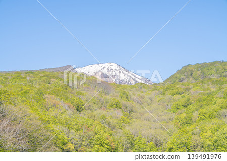 A mountain lake reflecting snow-capped mountains and lush green forests: a spring scene (Hakkoda Mountains, Aomori Prefecture) A mountain lake reflecting snow-capped mountains and lush green forests: a spring scene (Hakkoda Mountains, Aomori Prefecture) 139491976