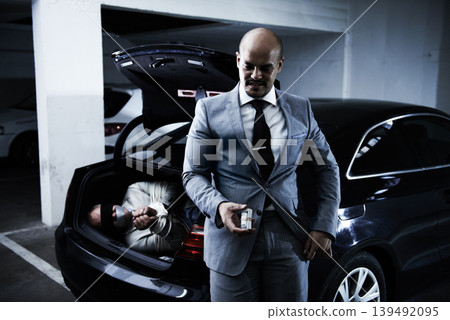 Man in trunk of car, kidnapping and criminal with money, danger and violence in basement garage. Crime, human trafficking and scared person tied with rope parking lot with gangster, ransom and mafia. Man in trunk of car, kidnapping and criminal with money, danger and violence in basement garage. Crime, human trafficking and scared person tied with rope parking lot with gangster, ransom and mafia. 139492095