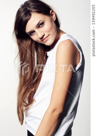 Portrait, skincare and hair with a natural woman in studio on a white background for cosmetic wellness. Beauty, haircare and a confident young person at the salon for shampoo or keratin treatment Portrait, skincare and hair with a natural woman in studio on a white background for cosmetic wellness. Beauty, haircare and a confident young person at the salon for shampoo or keratin treatment 139492205