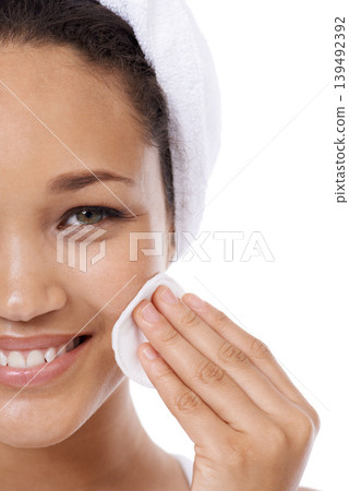 Woman face, cotton pad and skincare, beauty or cosmetics product for dermatology results in studio. Portrait of African person or model with hygiene wipe for makeup or facial on a white background Woman face, cotton pad and skincare, beauty or cosmetics product for dermatology results in studio. Portrait of African person or model with hygiene wipe for makeup or facial on a white background 139492392