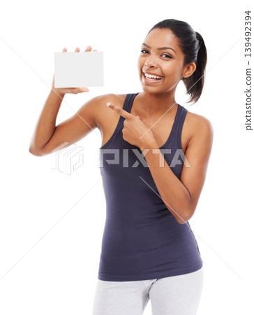 Woman, card and portrait of pointing to blank advertising, poster or mock up space in white background of studio. Indian, model and hand gesture to sign, post and paper for promotion or information Woman, card and portrait of pointing to blank advertising, poster or mock up space in white background of studio. Indian, model and hand gesture to sign, post and paper for promotion or information 139492394