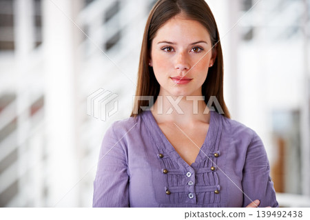 Portrait, confident and a business woman arms crossed in her professional office for an internship. Mindset, serious and attitude with a young employee in her design agency workplace or company Portrait, confident and a business woman arms crossed in her professional office for an internship. Mindset, serious and attitude with a young employee in her design agency workplace or company 139492438