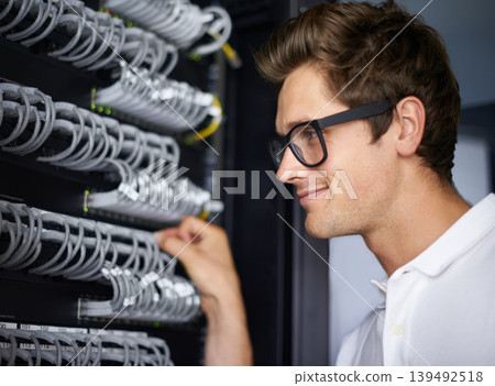 Server room, information technology and man with cables for connectivity, night and check hardware. Cybersecurity system, it network or person for internet, data center or storage solution with ideas 139492518