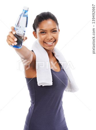 Woman, liquid and smile in portrait for workout, studio and water bottle for health and wellness. Athlete, female person and pride on face for fitness, weight loss and detox by white background Woman, liquid and smile in portrait for workout, studio and water bottle for health and wellness. Athlete, female person and pride on face for fitness, weight loss and detox by white background 139492667