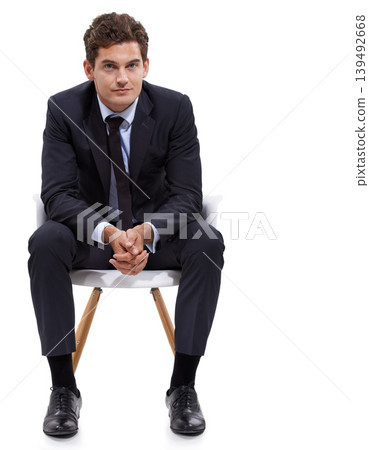 Businessman, sitting and portrait of manager in a chair with white background or mock up space in studio. Serious, entrepreneur and waiting on seat with professional style, fashion or suit for work 139492668