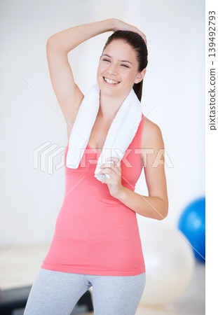 Laughing, gym or portrait of happy athlete with towel for fitness or wellness with confidence. Smile, funny model or healthy sports woman ready to start workout, training or exercise with energy Laughing, gym or portrait of happy athlete with towel for fitness or wellness with confidence. Smile, funny model or healthy sports woman ready to start workout, training or exercise with energy 139492793
