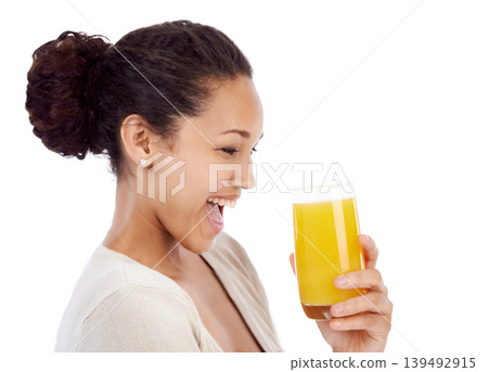 Happy, wow and woman with orange juice in studio for wellness, nutrition or detox on white background. Excited, smile or female nutritionist with glass of vitamin C, supplement or health fruit drink 139492915