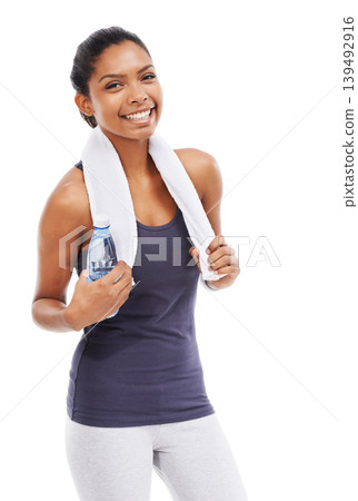 Woman, fitness and portrait with bottle, towel and smile for exercise, workout and training in studio on white background. Happy african athlete with water for hydration, wellness and healthy sports Woman, fitness and portrait with bottle, towel and smile for exercise, workout and training in studio on white background. Happy african athlete with water for hydration, wellness and healthy sports 139492916