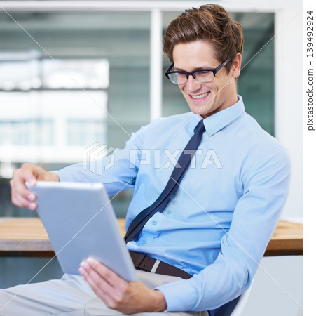 Happy business man, reading tablet and planning in office for investment, data analysis or software management. Professional person or analyst in glasses and vision for online report on digital tech Happy business man, reading tablet and planning in office for investment, data analysis or software management. Professional person or analyst in glasses and vision for online report on digital tech 139492924