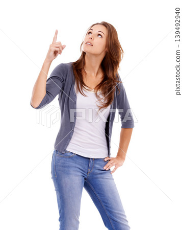 Pointing, looking and young woman in a studio with mockup for marketing, promotion or advertising. View, mock up and female person from Canada with show hand gesture isolated by white background. Pointing, looking and young woman in a studio with mockup for marketing, promotion or advertising. View, mock up and female person from Canada with show hand gesture isolated by white background. 139492940