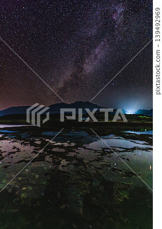 The Milky Way stretches across Harutahama Beach in Yakushima. The Milky Way stretches across Harutahama Beach in Yakushima. 139492969