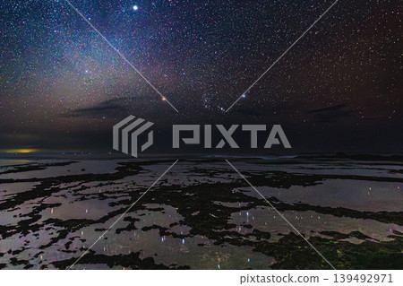 The fantastical night view of Yakushima Island illuminated by the constellation Orion. The fantastical night view of Yakushima Island illuminated by the constellation Orion. 139492971