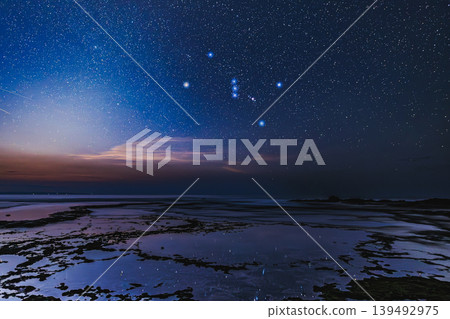The constellation Orion shines brightly over Harutahama Beach in Yakushima. The constellation Orion shines brightly over Harutahama Beach in Yakushima. 139492975