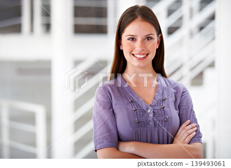 Portrait, smile and a business woman arms crossed in her office as a company intern at the start of her career. Mindset, confident and a happy young employee in a creative agency as a designer Portrait, smile and a business woman arms crossed in her office as a company intern at the start of her career. Mindset, confident and a happy young employee in a creative agency as a designer 139493061