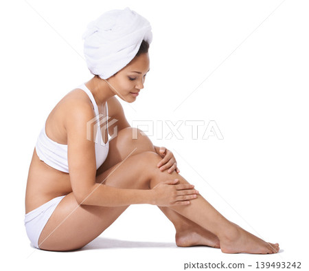 Young woman, legs and skincare in studio for hair removal results, self care and beauty on floor on a white background. Happy person or model in underwear and body cosmetics, skin care or dermatology Young woman, legs and skincare in studio for hair removal results, self care and beauty on floor on a white background. Happy person or model in underwear and body cosmetics, skin care or dermatology 139493242