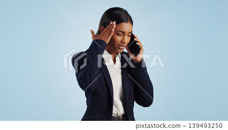 Business, phone call and woman with stress, headache and employee isolated on a blue studio background. Mockup space, person and entrepreneur with a cellphone, connection and frustrated with migraine Business, phone call and woman with stress, headache and employee isolated on a blue studio background. Mockup space, person and entrepreneur with a cellphone, connection and frustrated with migraine 139493250