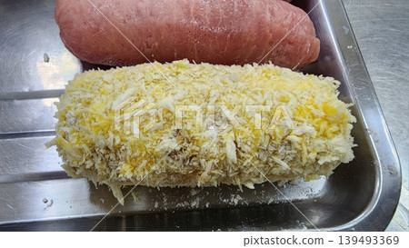 Raw Breaded Meat Cutlet Prepared for Cooking in a Stainless Steel Tray Raw Breaded Meat Cutlet Prepared for Cooking in a Stainless Steel Tray 139493369