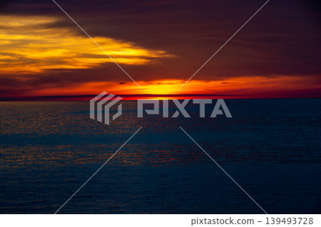 Beautiful dusk sea and orange sky 139493728