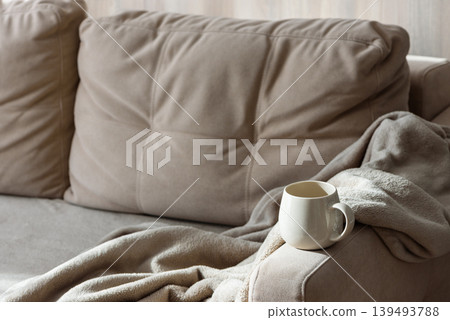 Cozy Sofa with Blanket and Coffee Mug. Relaxed Home Atmosphere Cozy Sofa with Blanket and Coffee Mug. Relaxed Home Atmosphere 139493788