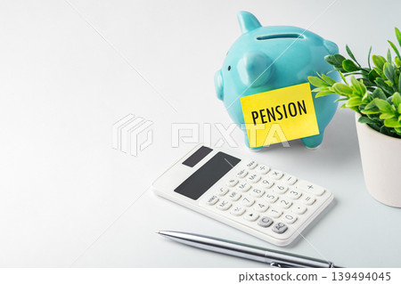 Blue piggy bank with pension sticky note and calculator on white desk, retirement planning, pension funds, and future savings concept Blue piggy bank with pension sticky note and calculator on white desk, retirement planning, pension funds, and future savings concept 139494045