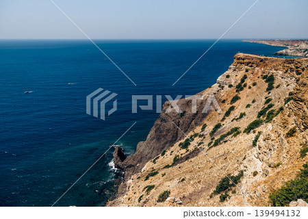 Cape Fiolent in Crimea, view of Black Sea and cliff in summer on sunny day Cape Fiolent in Crimea, view of Black Sea and cliff in summer on sunny day 139494132