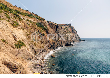 Cape Fiolent in Crimea, view of Black Sea and cliff in summer on sunny day Cape Fiolent in Crimea, view of Black Sea and cliff in summer on sunny day 139494136