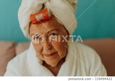 Senior woman with hair wrapped in a towel after shower. 139494422