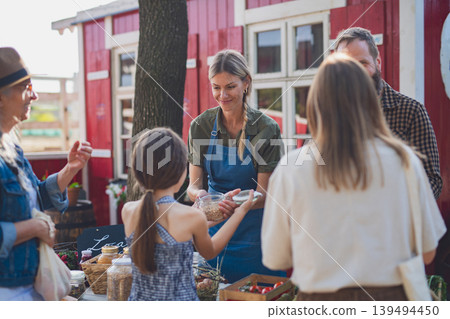 Buying organic produce at local farmers market. Buying organic produce at local farmers market. 139494450