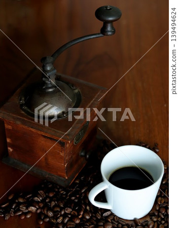 Antique coffee grinder and dark roast coffee Antique coffee grinder and dark roast coffee 139494624