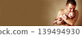 Closeup portrait of young father holding his newborn baby. Fathers day holiday, love, care concept. 139494930