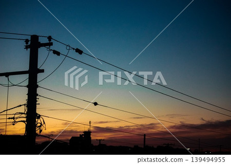 Telephone pole floating in the sky at dusk 139494955