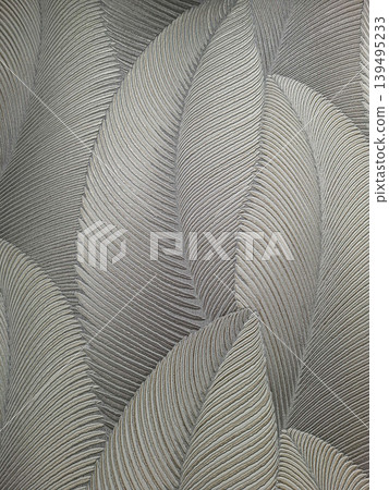 The design shows a pattern of large embossed palm leaves in silver and grey colors. The wallpaper features a metallic shimmer that enhances the motifs, ideal for interior spaces. The design shows a pattern of large embossed palm leaves in silver and grey colors. The wallpaper features a metallic shimmer that enhances the motifs, ideal for interior spaces. 139495233