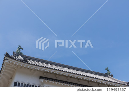 Copy space for the roof of the main gate at Tsurumaru Castle ruins and the blue sky (Kagoshima Castle ruins) Copy space for the roof of the main gate at Tsurumaru Castle ruins and the blue sky (Kagoshima Castle ruins) 139495867